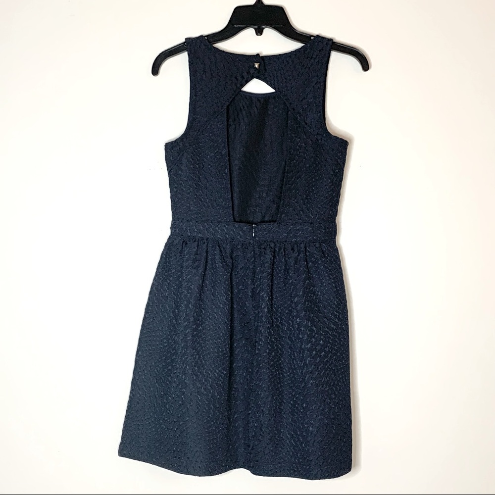 Blue size small dress with opening in back. Snug fit in waist